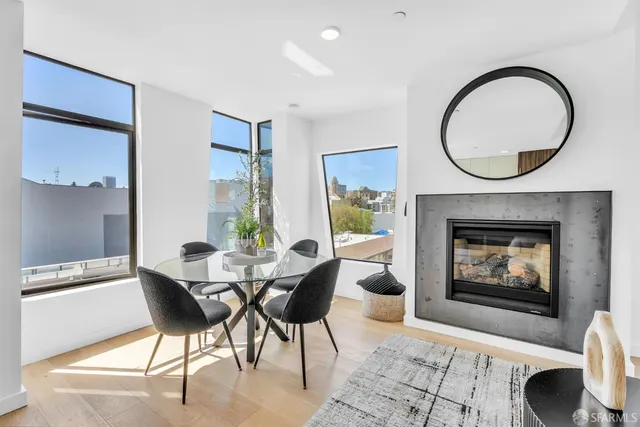 a living room with furniture a window and a fireplace
