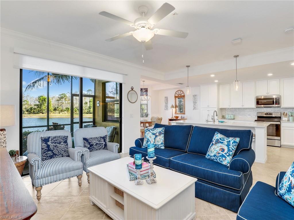 9584 Trevi Court, Unit 5213 Naples, FL 34113 - Photo 14 of 50 a living room with furniture kitchen view and a large window