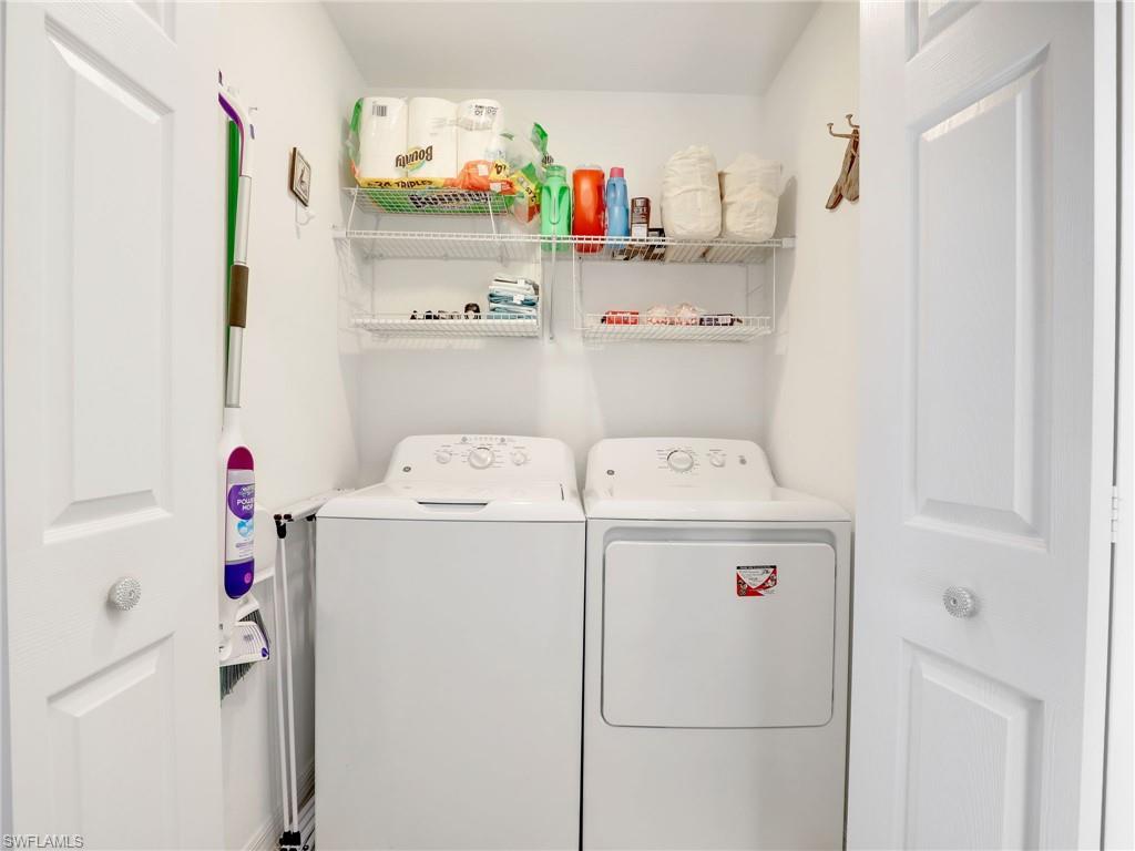 9584 Trevi Court, Unit 5213 Naples, FL 34113 - Photo 25 of 50 a utility room with dryer and washer