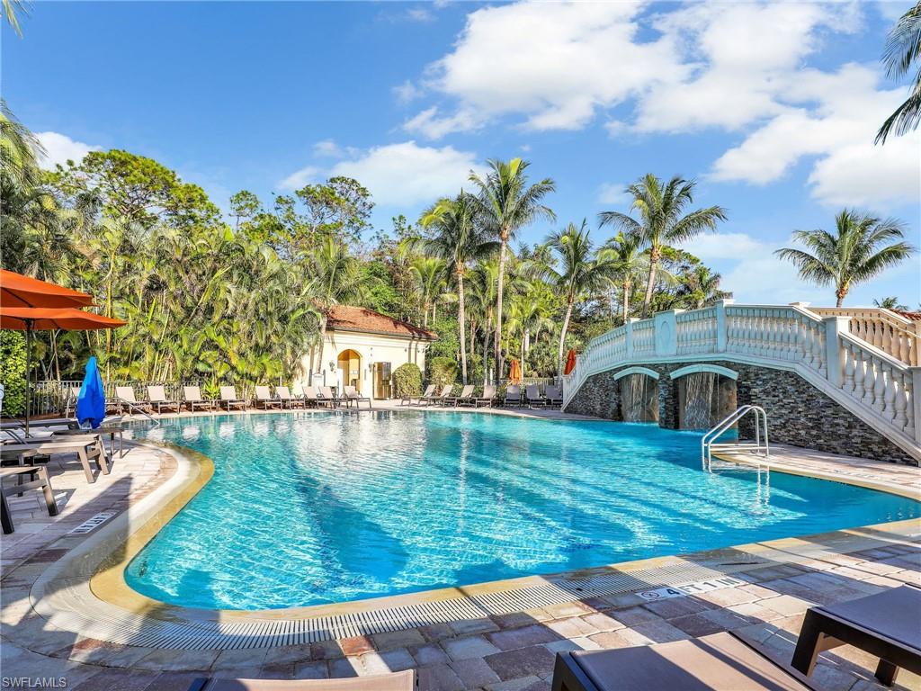 9584 Trevi Court, Unit 5213 Naples, FL 34113 - Photo 38 of 50 a view of a swimming pool with a patio