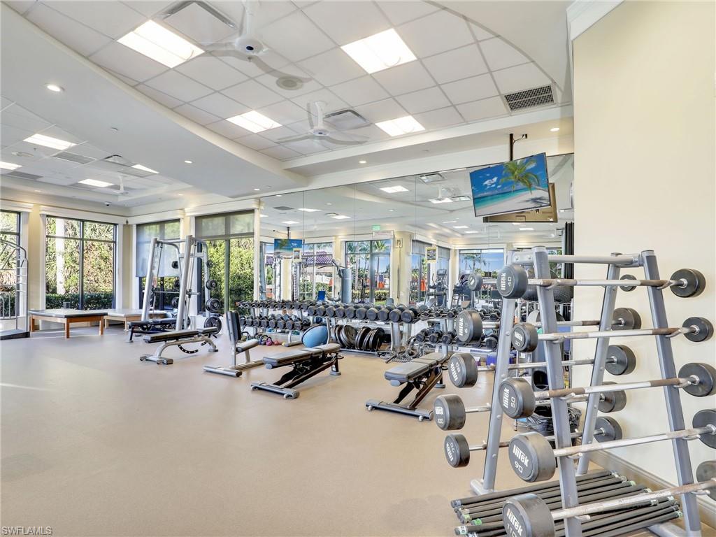 9584 Trevi Court, Unit 5213 Naples, FL 34113 - Photo 41 of 50 a view of a room with gym equipment
