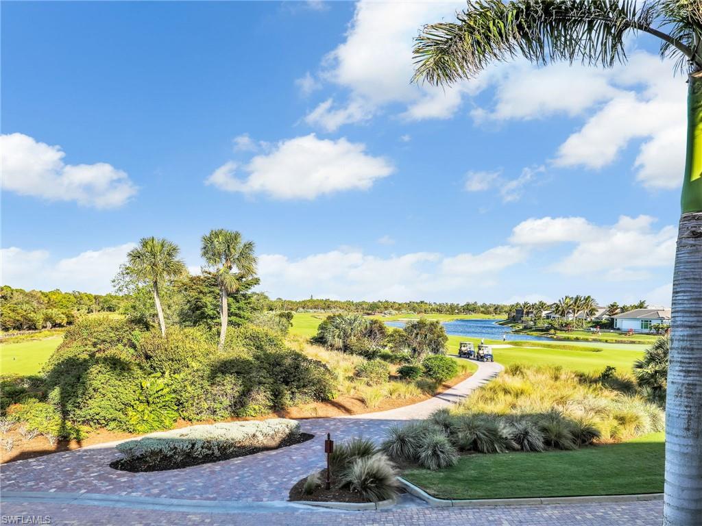 9584 Trevi Court, Unit 5213 Naples, FL 34113 - Photo 50 of 50 a view of a lake with a big yard