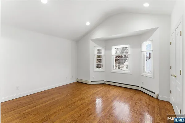 a view of an empty room with a closet
