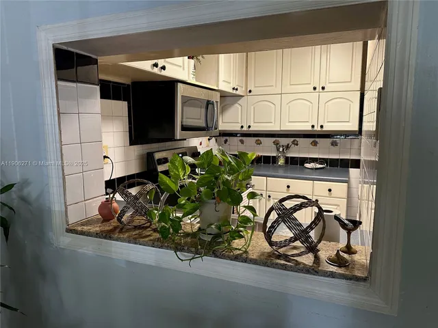 a kitchen with a stove and cabinets