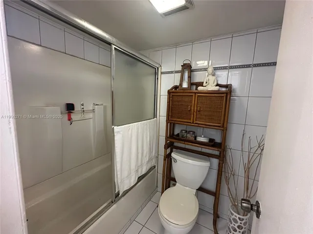 a bathroom with a shower and a bathtub