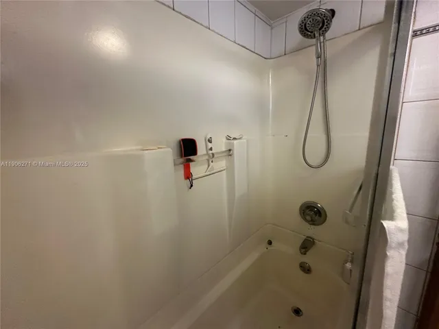 a view of a hallway to rooms and stairs