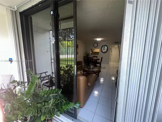 a front view of a house with a flower garden