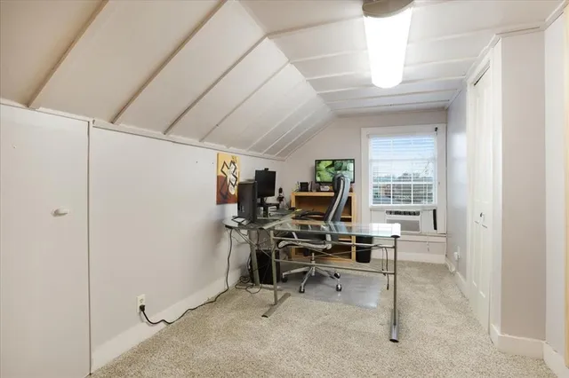 a view of a livingroom with furniture and a flat screen tv