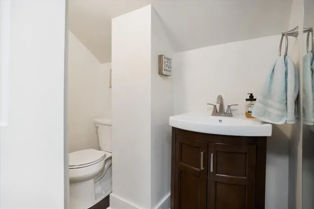 a view of a backyard with a large tree