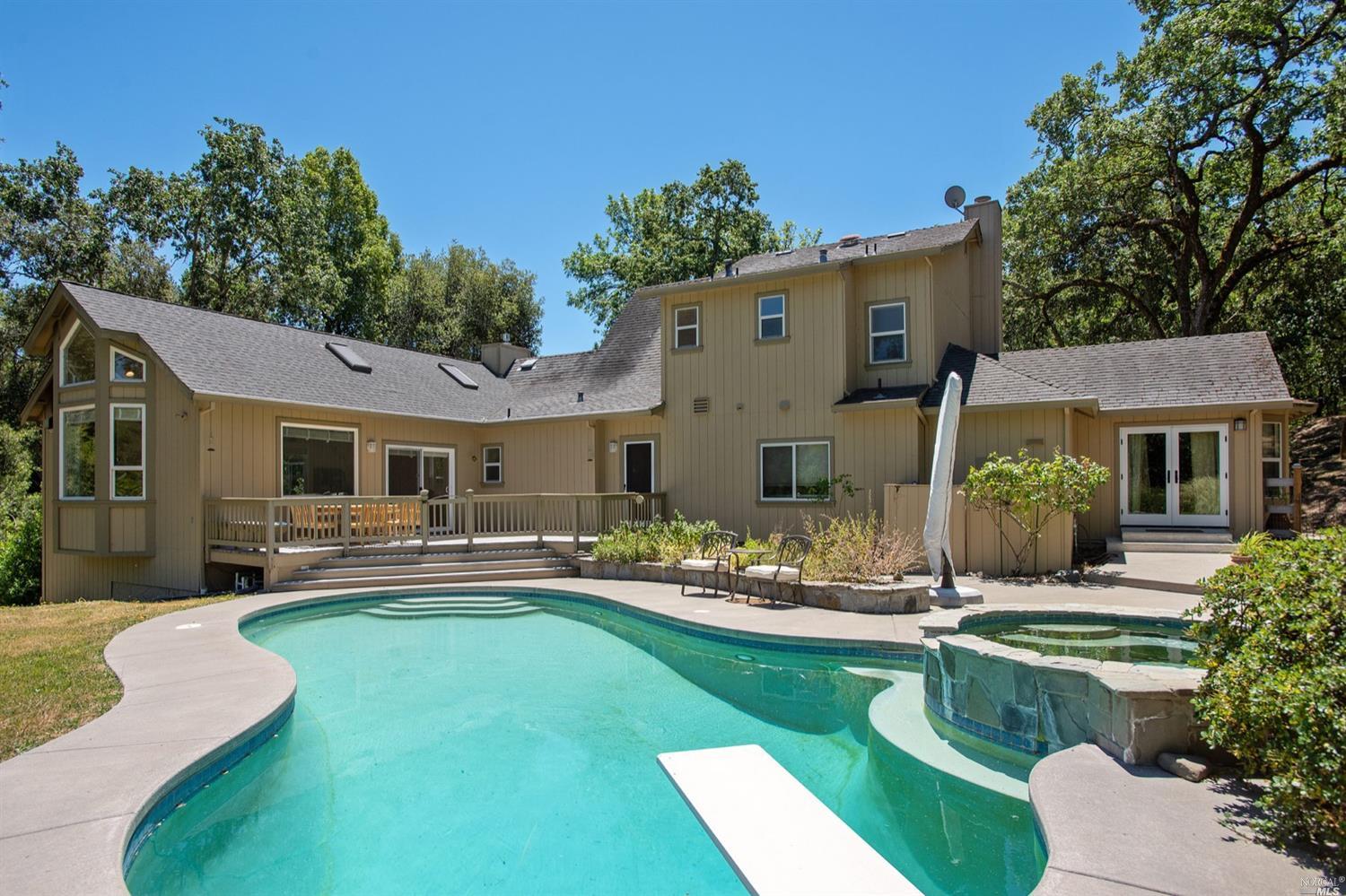 4343 Sonoma Mountain Road Santa Rosa, CA 95404 - Photo 1 of 1 a front view of house with yard and outdoor seating