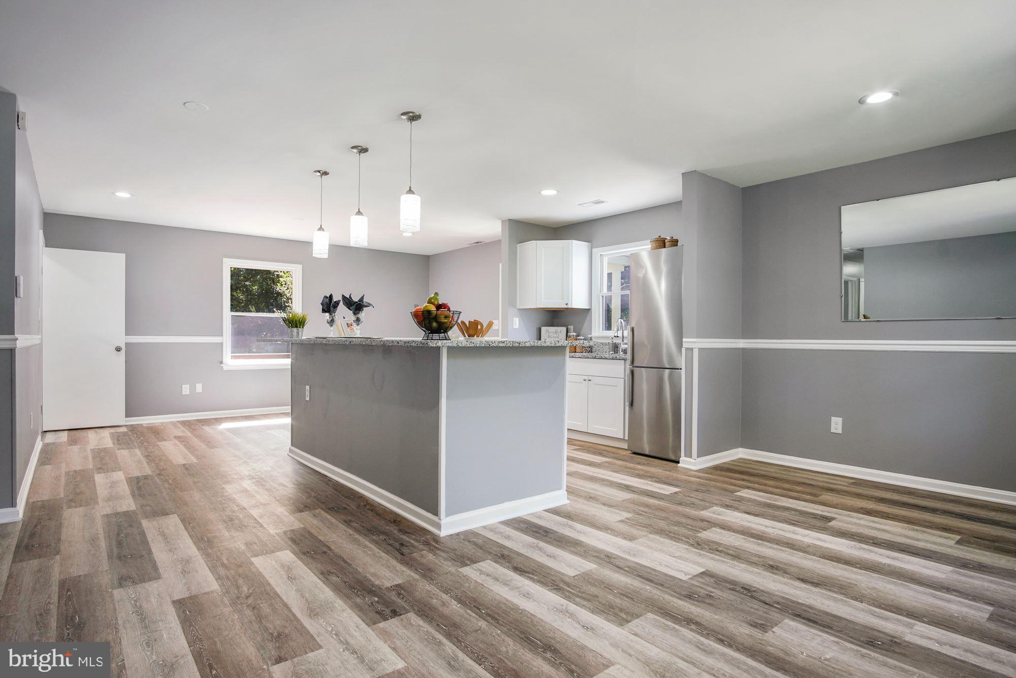 14541 Good Hope Road Silver Spring, MD 20905 - Photo 11 of 32 Pendant lighting over the island