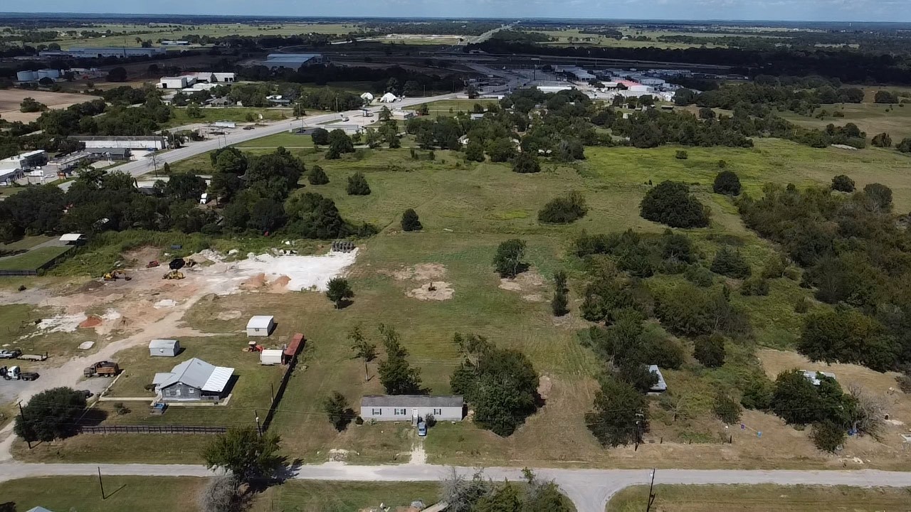 an aerial view of residential houses with outdoor space
