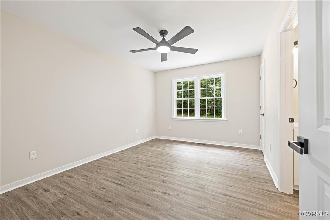 13601 Pole Run Road Disputanta, VA 23842 - Photo 15 of 22 Unfurnished room featuring ceiling fan, LVP floors
