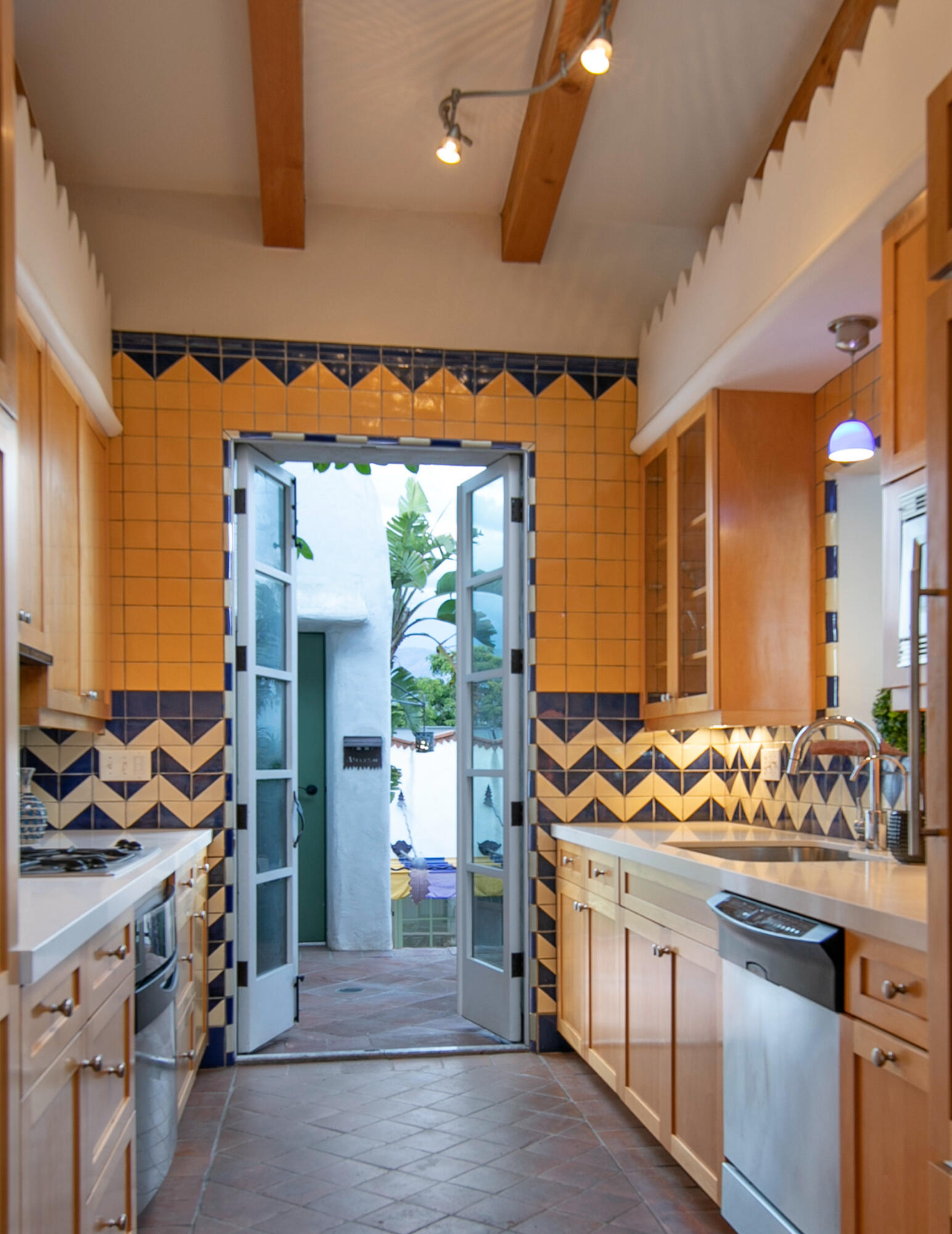 407 State Street Santa Barbara, CA 93101 - Photo 6 of 32 Kitchen opening to patio