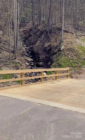a view of a refrigerator with wooden fence