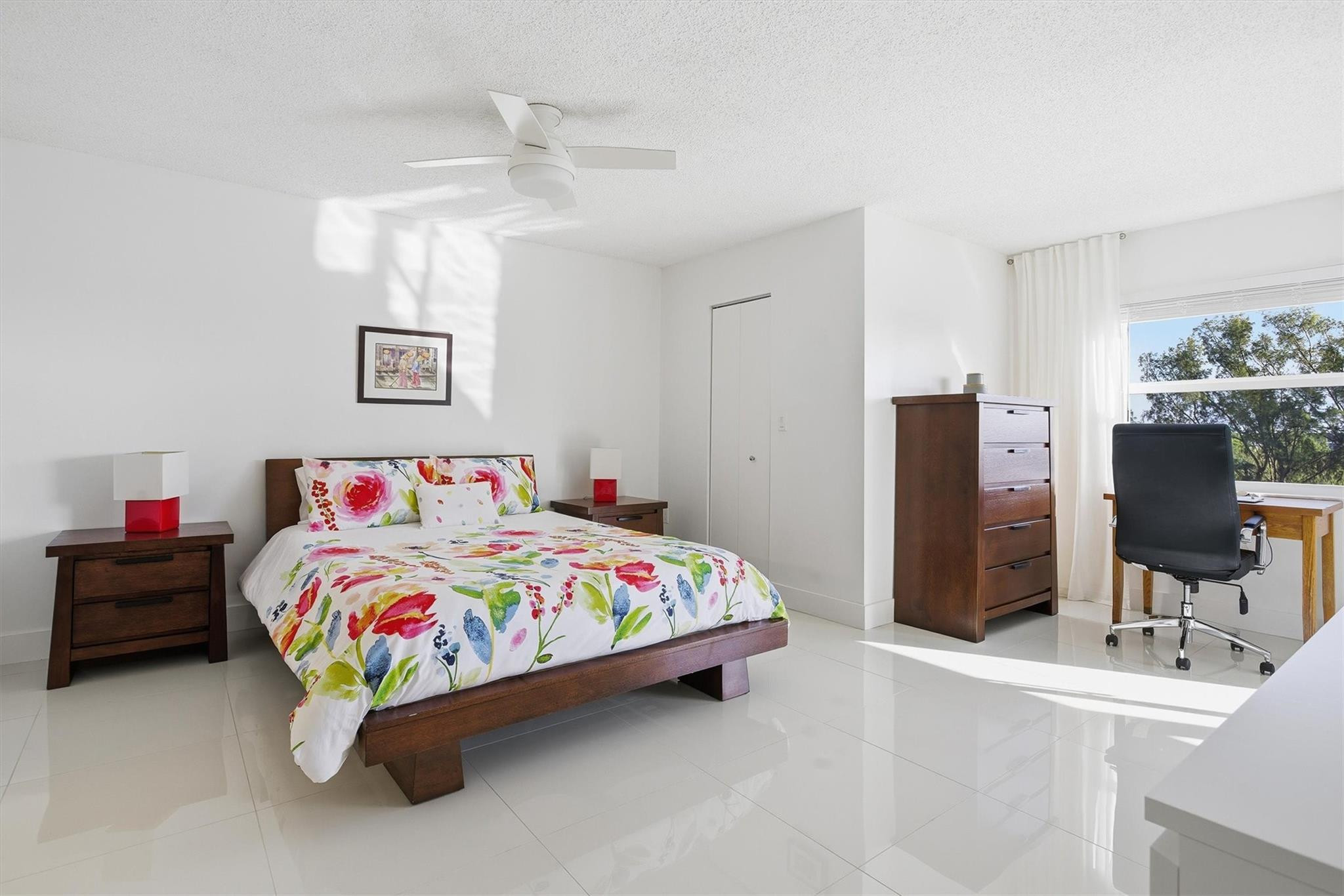 3930 Inverrary Boulevard, Unit 605D Fort Lauderdale, FL 33319 - Photo 14 of 52 a bedroom with a bed and a table in it