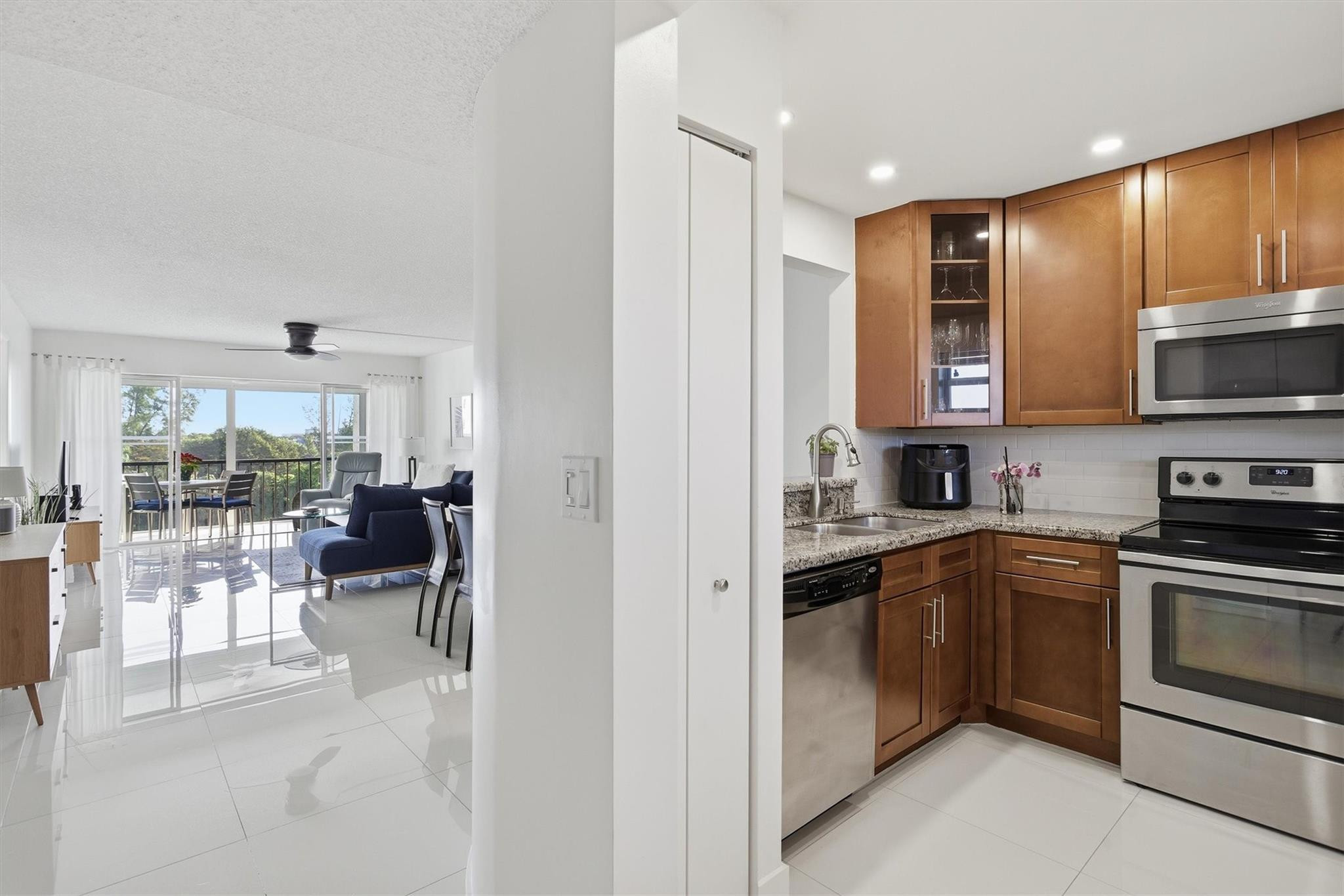 3930 Inverrary Boulevard, Unit 605D Fort Lauderdale, FL 33319 - Photo 17 of 52 a kitchen with a sink cabinets and stainless steel appliances