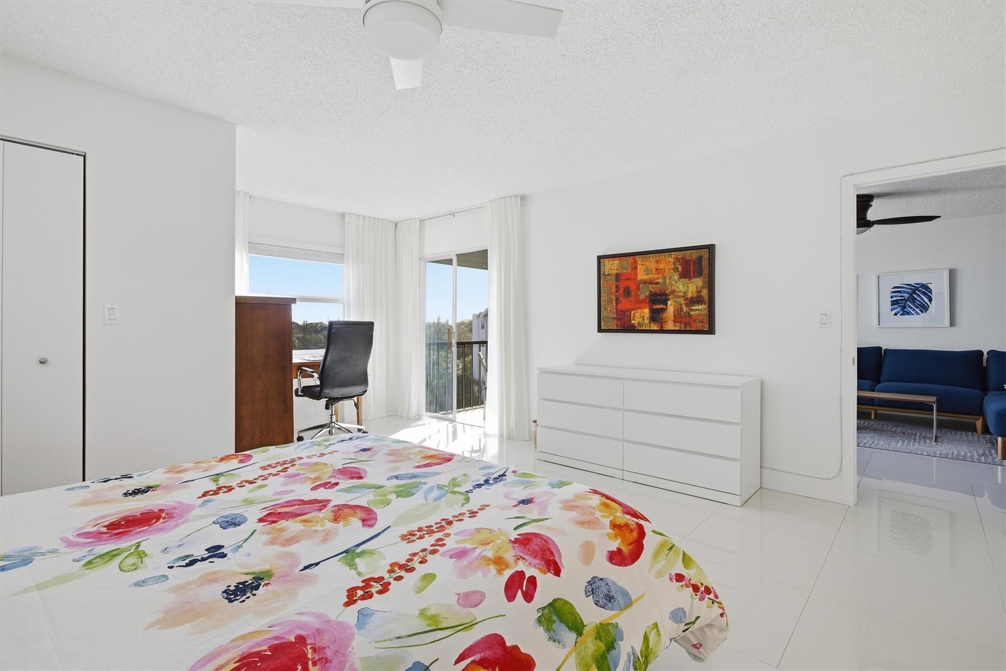 3930 Inverrary Boulevard, Unit 605D Fort Lauderdale, FL 33319 - Photo 19 of 52 a bedroom with a bed and a dresser in it