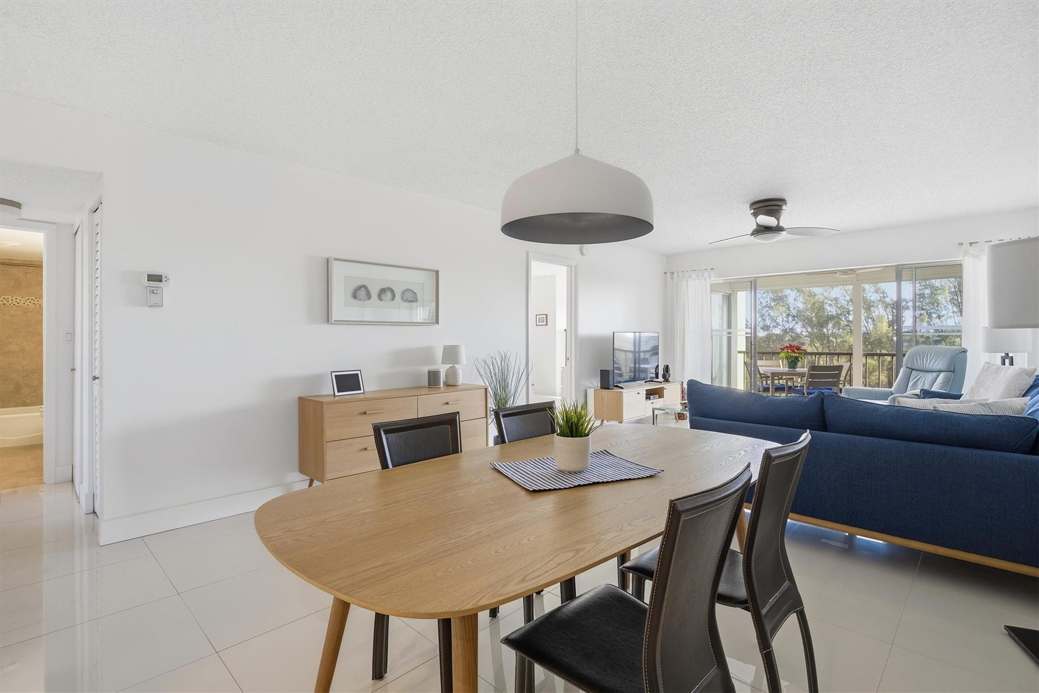 3930 Inverrary Boulevard, Unit 605D Fort Lauderdale, FL 33319 - Photo 2 of 52 a view of a dining room with furniture window and outside view