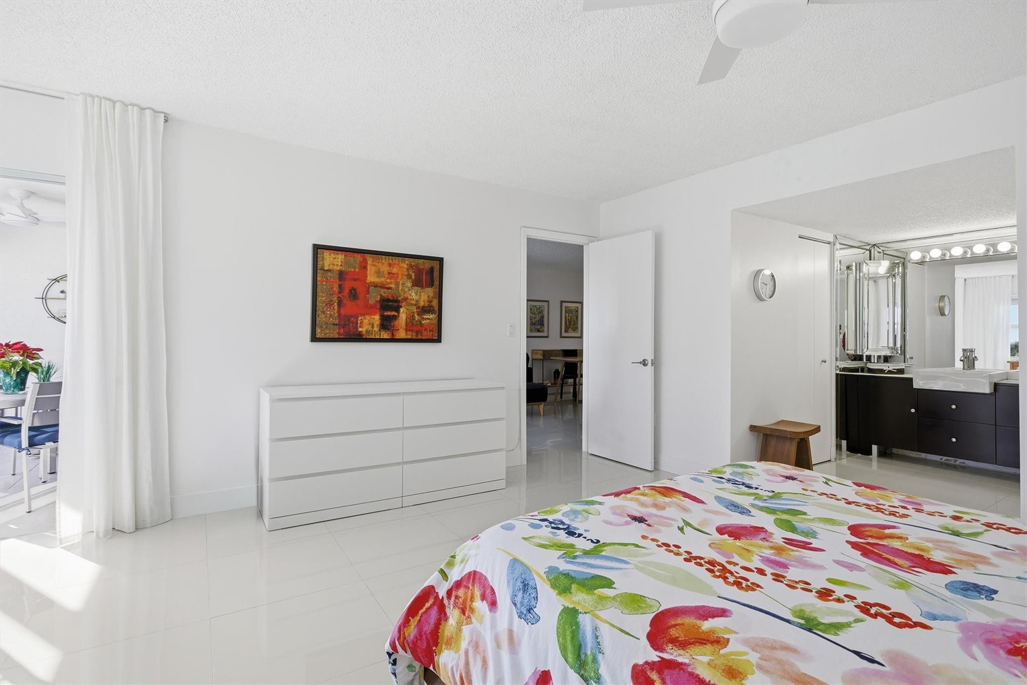 3930 Inverrary Boulevard, Unit 605D Fort Lauderdale, FL 33319 - Photo 21 of 52 a bedroom with a bed and a dresser