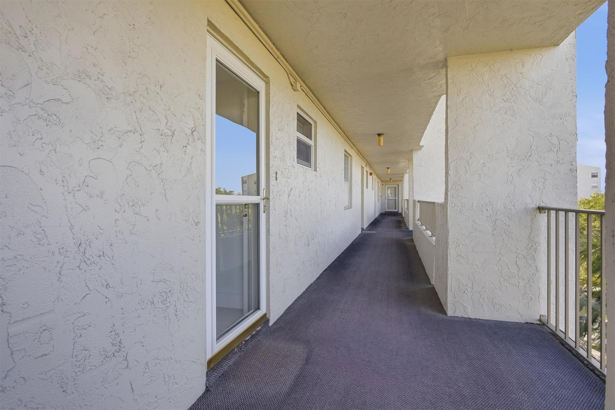 3930 Inverrary Boulevard, Unit 605D Fort Lauderdale, FL 33319 - Photo 29 of 52 a view of a hallway with white walls