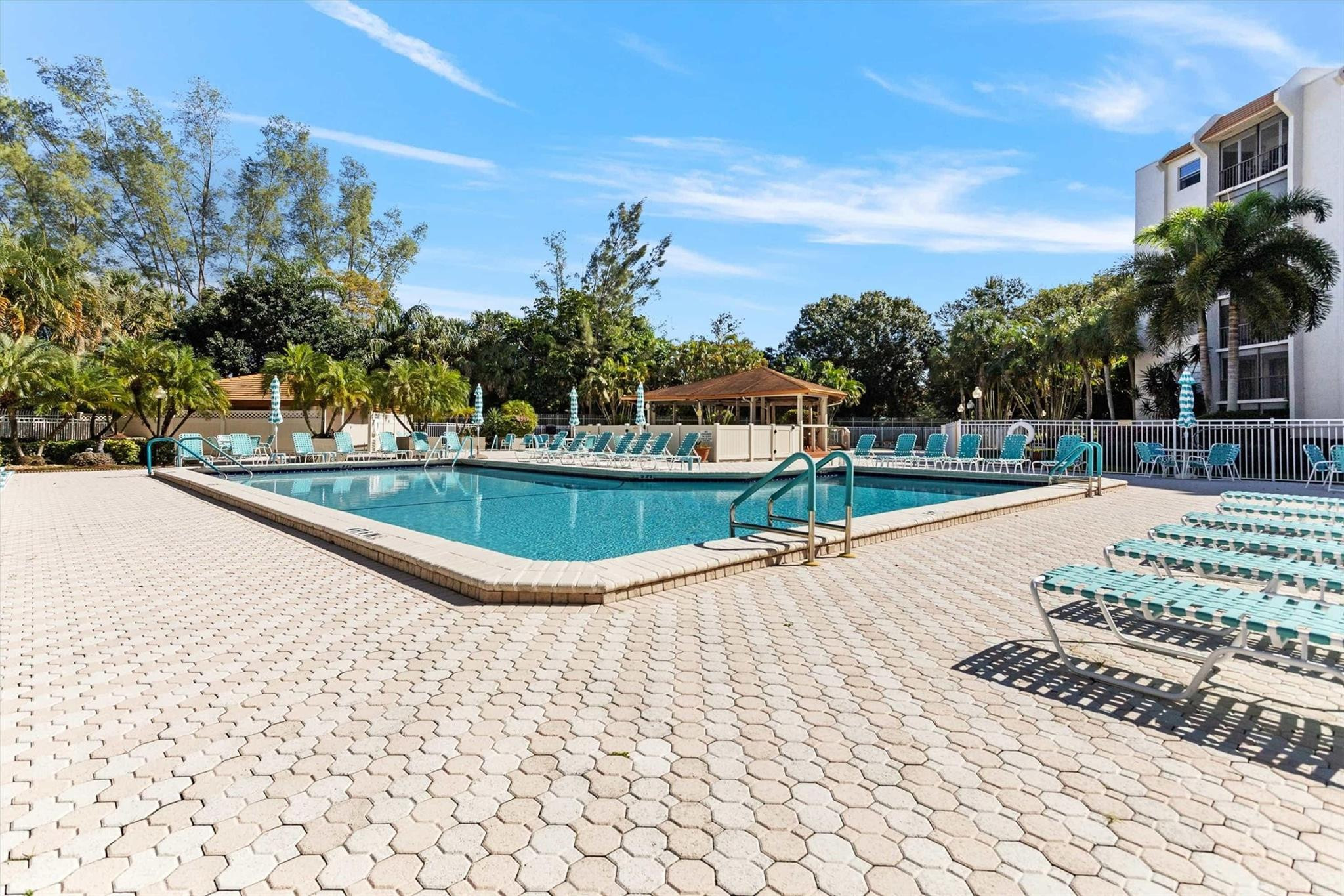 3930 Inverrary Boulevard, Unit 605D Fort Lauderdale, FL 33319 - Photo 33 of 52 a view of a swimming pool with a patio