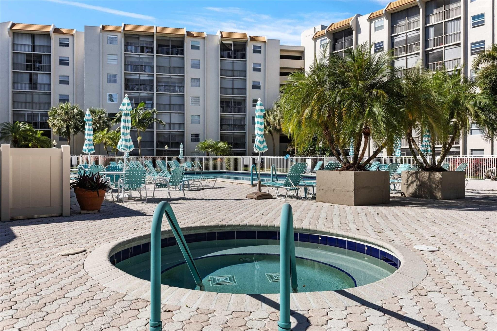 3930 Inverrary Boulevard, Unit 605D Fort Lauderdale, FL 33319 - Photo 38 of 52 a view of a swimming pool with a lounge chairs