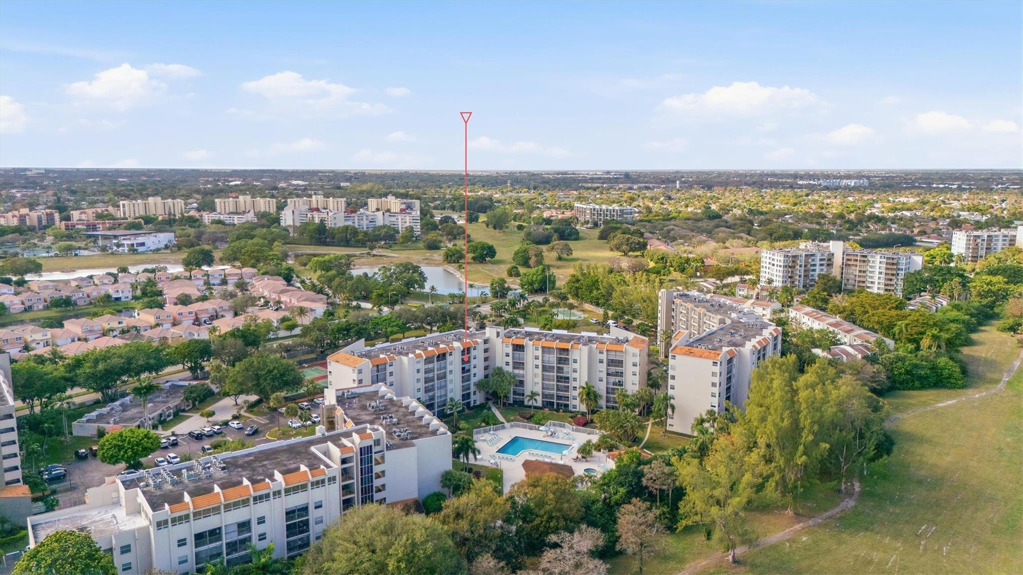 3930 Inverrary Boulevard, Unit 605D Fort Lauderdale, FL 33319 - Photo 50 of 52 an aerial view of a city with lots of residential buildings ocean and mountain view in back