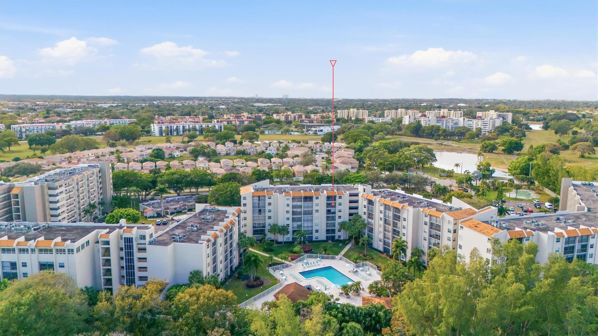3930 Inverrary Boulevard, Unit 605D Fort Lauderdale, FL 33319 - Photo 51 of 52 an aerial view of a city with lots of residential buildings ocean and mountain view in back