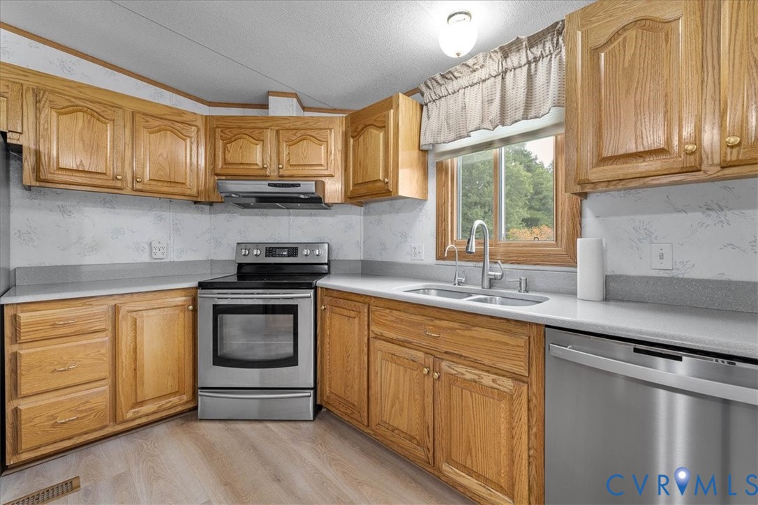 6626 Claiborne Road Sutherland, VA 23885 - Photo 19 of 37 Newer cabinets and solid surface countertops!