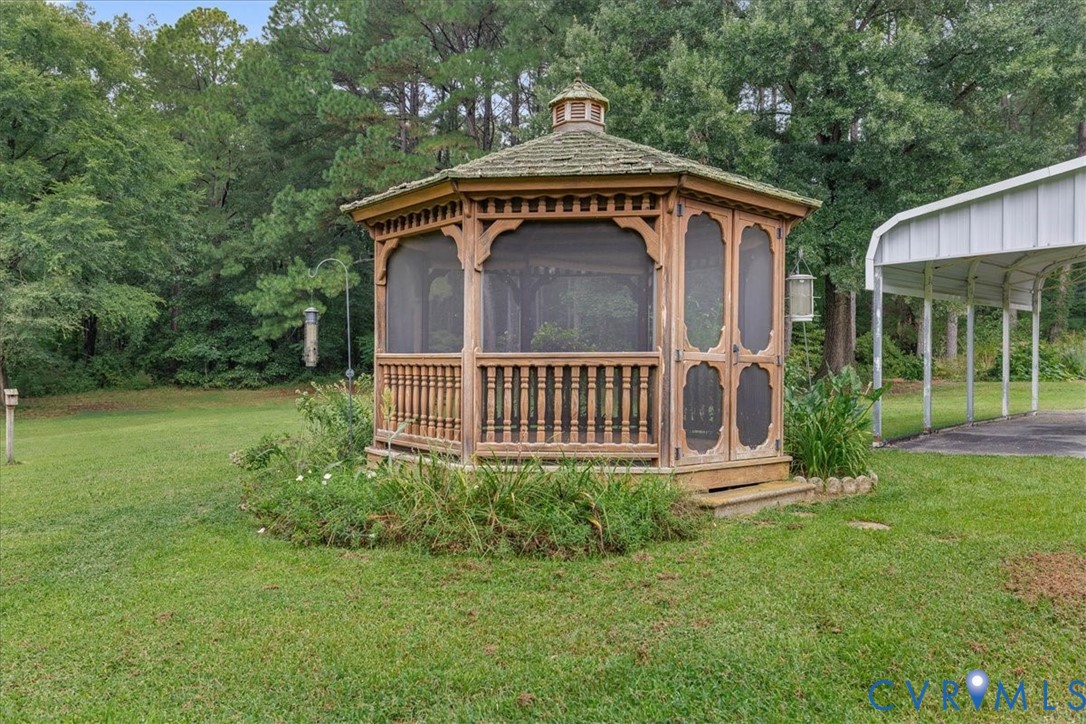 6626 Claiborne Road Sutherland, VA 23885 - Photo 4 of 37 View of green lawn featuring a gazebo that is full