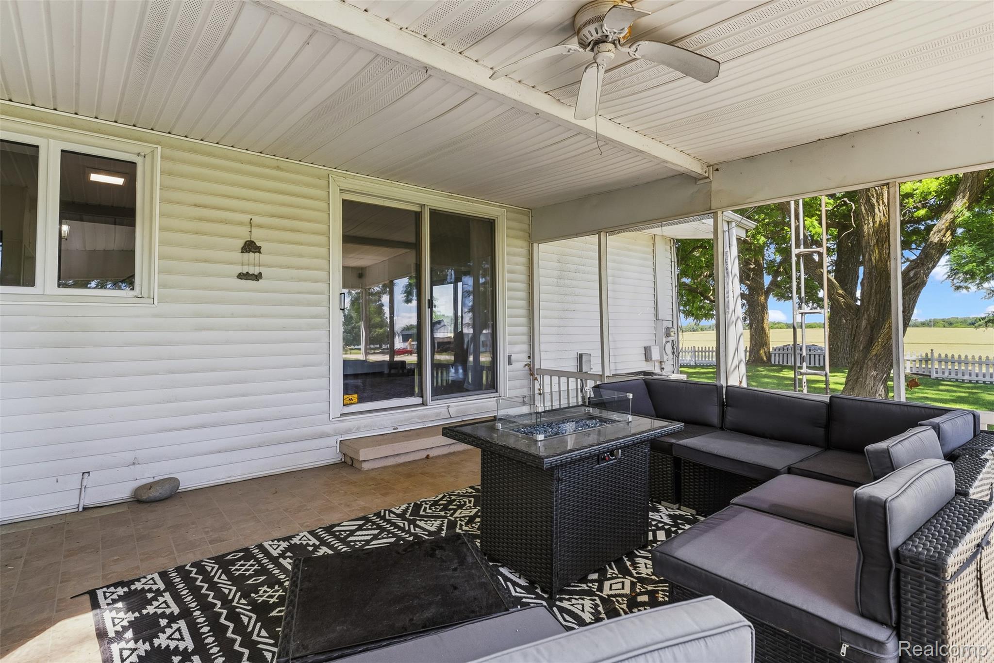 5843 West Dewey Road Owosso, MI 48867 - Photo 42 of 58 Screened porch with durable tile flooring and a ceiling fan