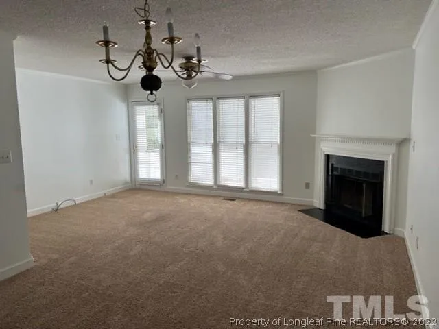 a view of a livingroom with a fireplace