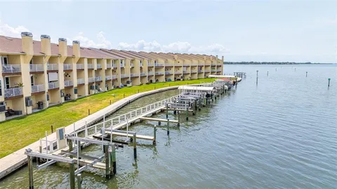 a view of a lake with a yard