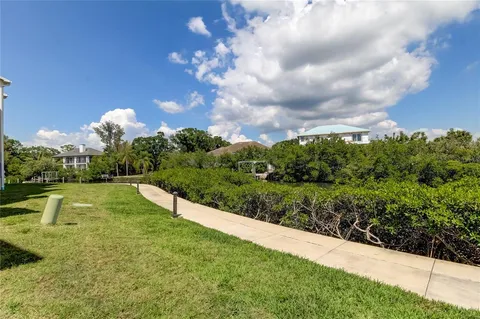 a view of balcony with outdoor seating and ocean view
