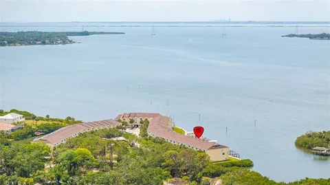 a view of a swimming pool with outdoor seating