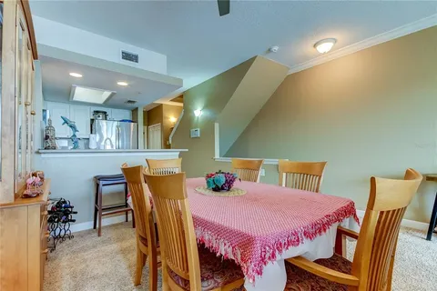 a kitchen with granite countertop a refrigerator stove and sink