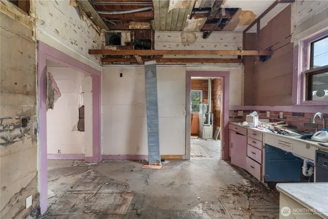 a kitchen with a stove and a sink