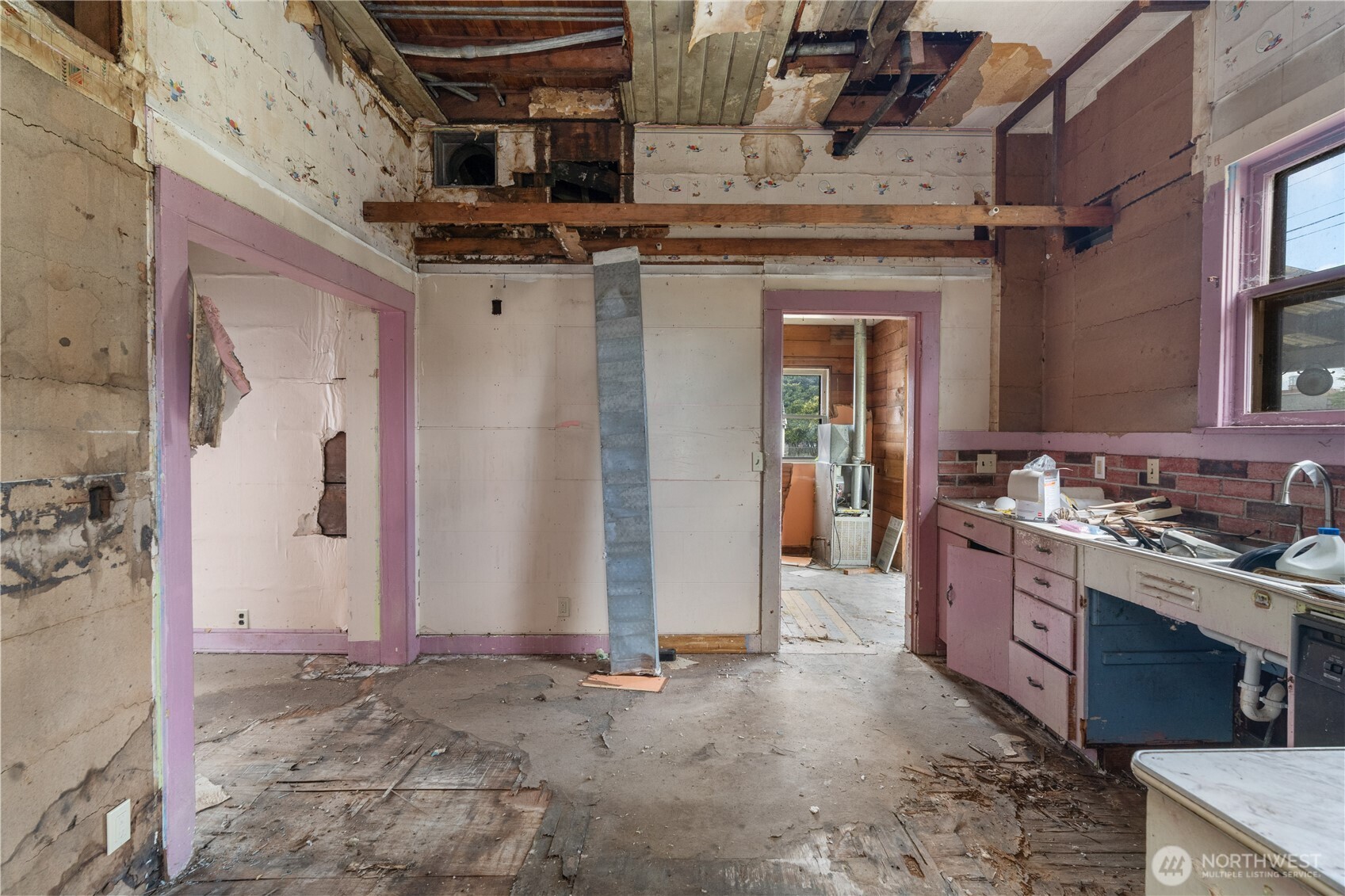 504 9th Street Hoquiam, WA 98550 - Photo 14 of 40 a view of a kitchen with a sink and cabinets