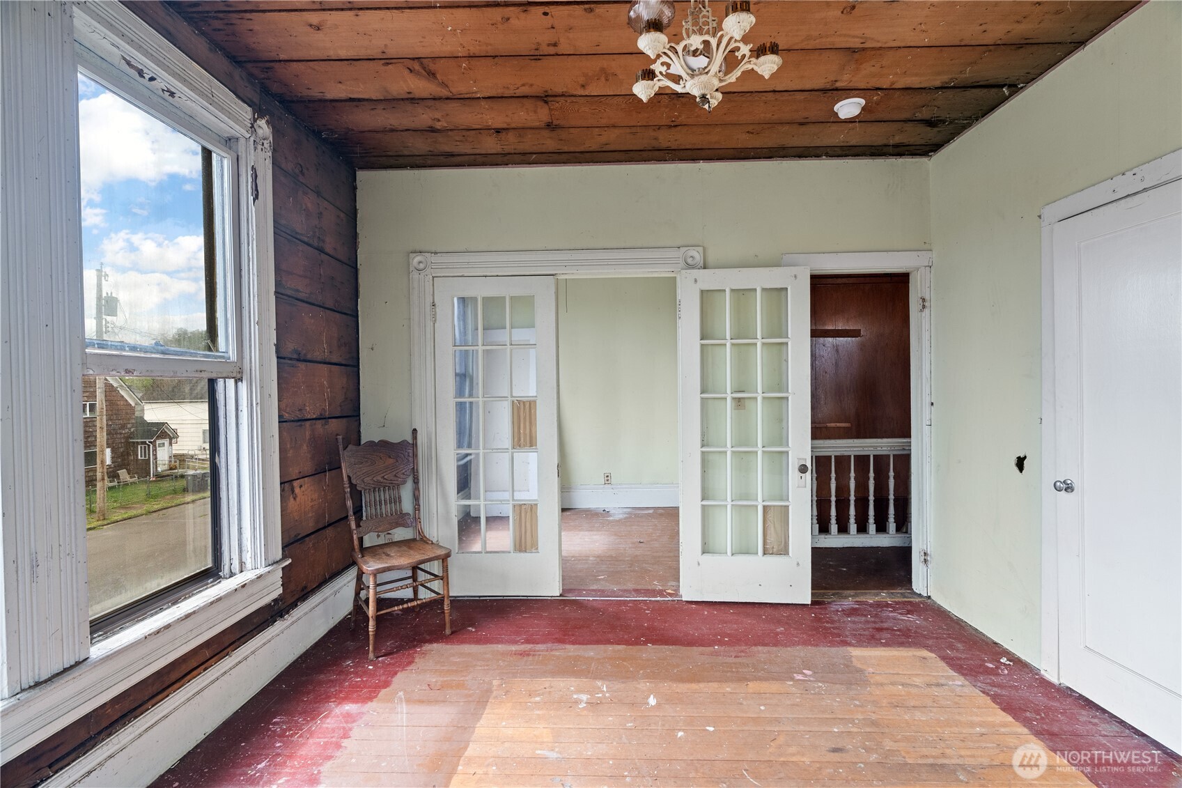 504 9th Street Hoquiam, WA 98550 - Photo 30 of 40 a view of a room with a chandelier and wooden floor
