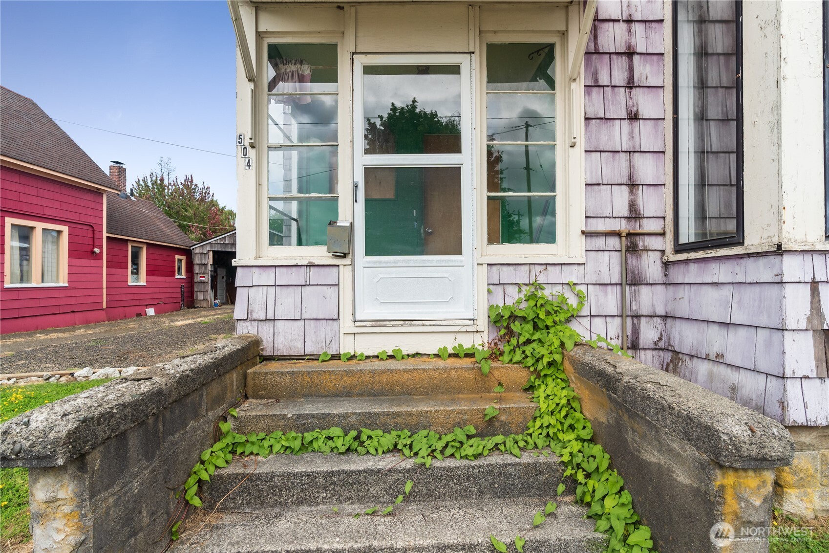 504 9th Street Hoquiam, WA 98550 - Photo 3 of 40 a view of a brick house with many windows