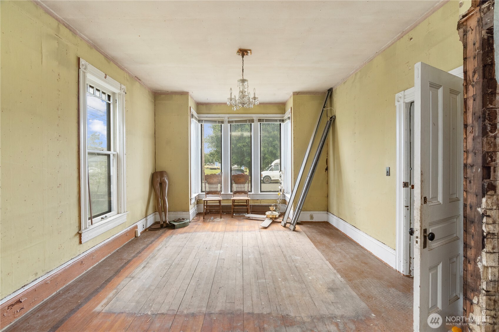 504 9th Street Hoquiam, WA 98550 - Photo 6 of 40 a view of a room with wooden floor and windows