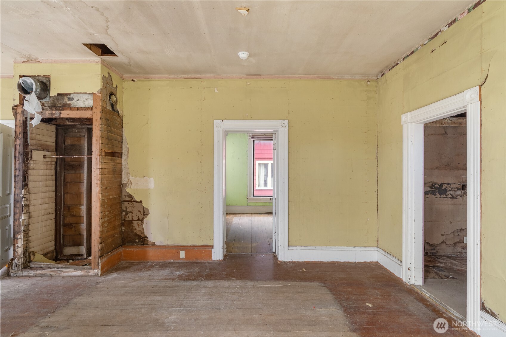 504 9th Street Hoquiam, WA 98550 - Photo 10 of 40 a view of a hallway with wooden shelves