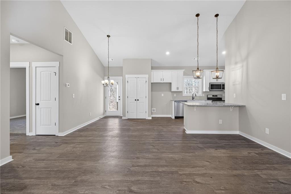 1549 Winn Road Douglasville, GA 30134 - Photo 12 of 36 a view of kitchen with kitchen island white cabinets and stainless steel appliances