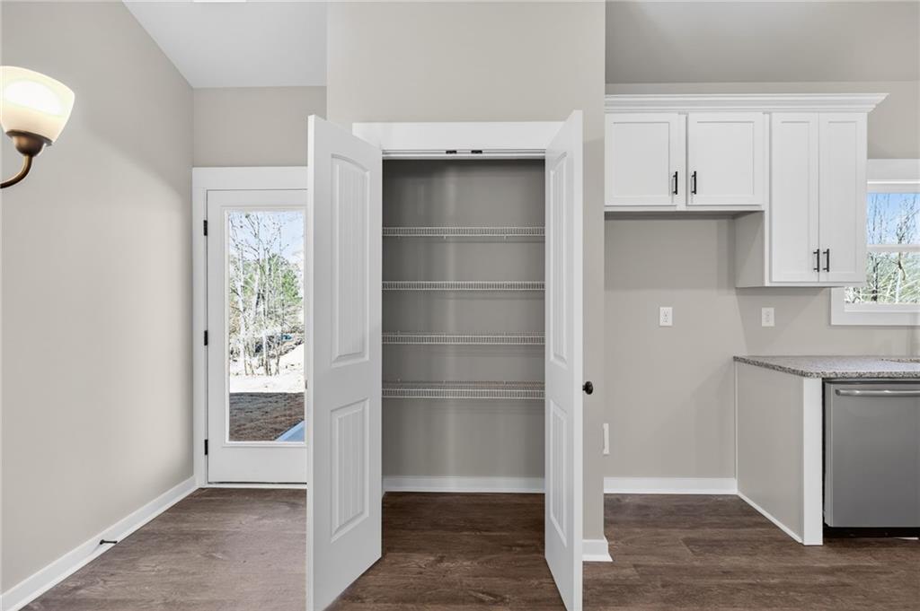1549 Winn Road Douglasville, GA 30134 - Photo 18 of 36 a view of an empty room with cabinet and a window