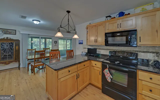 a bedroom with a bed a desk and chair