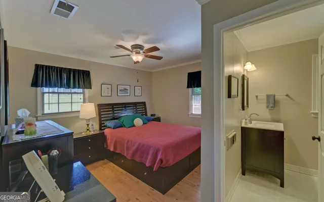 a bathroom with a sink a mirror and a window