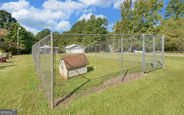 a view of a swimming pool with a patio