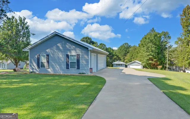 a view of a balcony with furniture and wooden floor