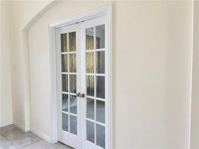 a large kitchen with kitchen island stainless steel appliances a sink counter space and a window